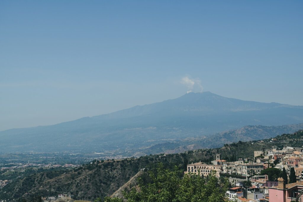 a view of a city with a mountain in the background