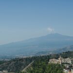 a view of a city with a mountain in the background